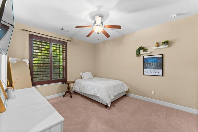 4022 Hidden Winds Dr, Spring, TX 77386 - bedroom featuring light colored carpet, baseboards, and a ceiling fan