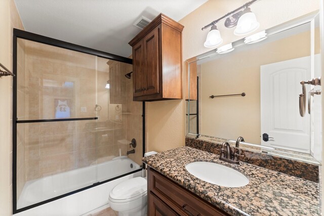 4022 Hidden Winds Dr, Spring, TX 77386 - bathroom with vanity, shower / bath combination with glass door, and toilet
