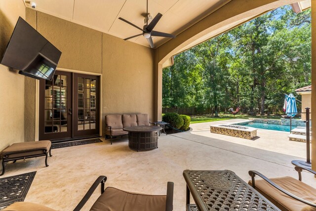 4022 Hidden Winds Dr, Spring, TX 77386 - view of patio / terrace with french doors, an outdoor pool, and ceiling fan