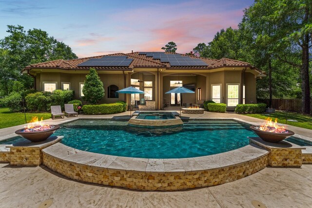 4022 Hidden Winds Dr, Spring, TX 77386 - view of swimming pool with an outdoor fire pit, a patio area, and a pool with connected hot tub