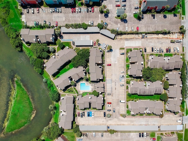 3220 69th St Unit B8, Galveston, TX 77551 - aerial view of property and surrounding area with a large body of water and a pool