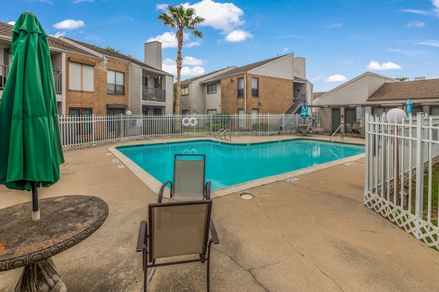 3220 69th St Unit B8, Galveston, TX 77551 - community pool featuring a patio area and a residential view