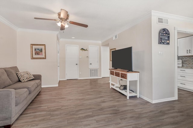3220 69th St Unit B8, Galveston, TX 77551 - living room featuring ornamental molding, ceiling fan, wood finished floors, and baseboards