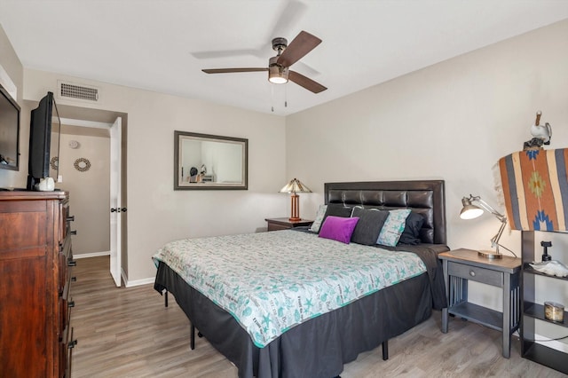 3220 69th St Unit B8, Galveston, TX 77551 - bedroom featuring wood finished floors, baseboards, and a ceiling fan