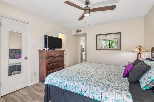 3220 69th St Unit B8, Galveston, TX 77551 - bedroom featuring light wood-style floors and a ceiling fan