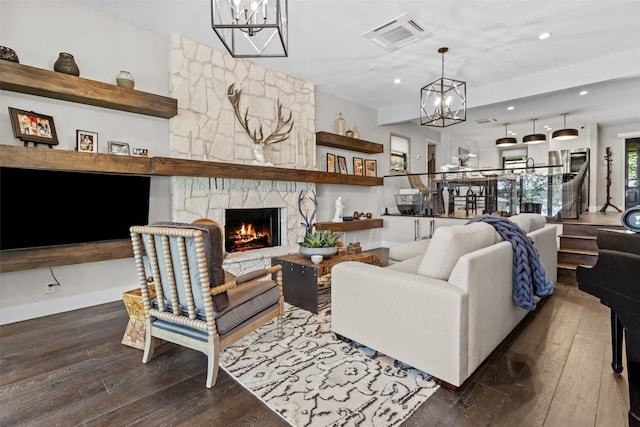 678 Sawmill St, Crockett, TX 75835 - living room with a chandelier, hardwood / wood-style floors, a fireplace, and recessed lighting