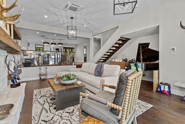678 Sawmill St, Crockett, TX 75835 - living room featuring stairs, wood finished floors, recessed lighting, a chandelier, and baseboards