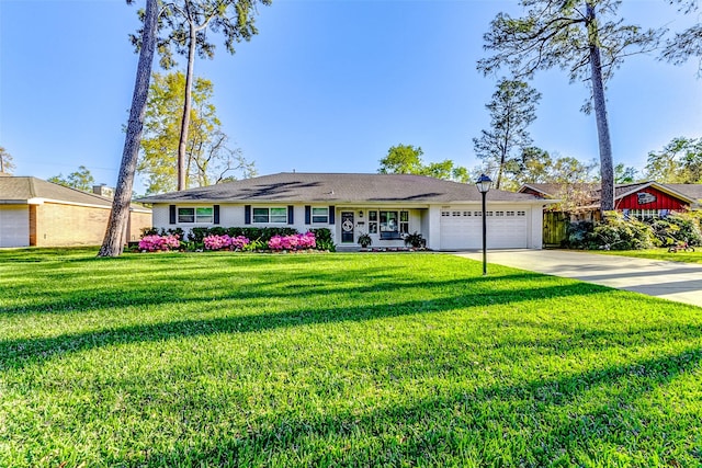10207 Chatterton Dr, Houston, TX 77043 - ranch-style house with an attached garage, driveway, and a front lawn