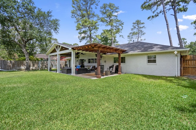 10207 Chatterton Dr, Houston, TX 77043 - rear view of house featuring a patio, a ceiling fan, brick siding, and an outdoor hangout area