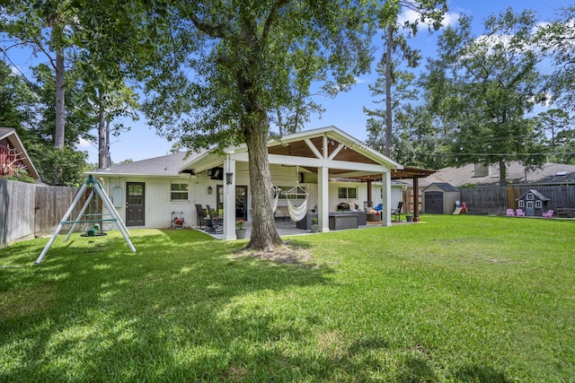 10207 Chatterton Dr, Houston, TX 77043 - back of house with a patio area, a playground, and brick siding