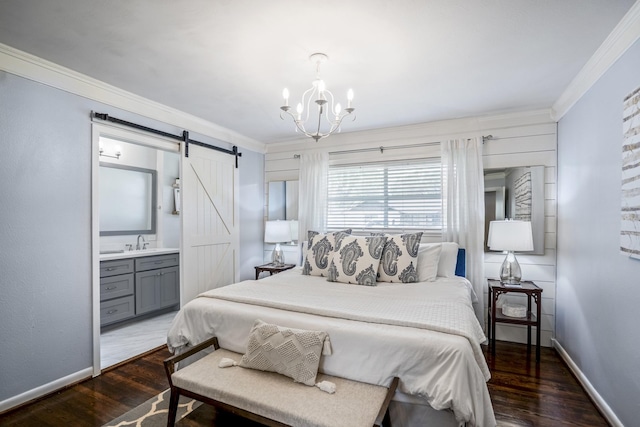 10207 Chatterton Dr, Houston, TX 77043 - bedroom with ornamental molding, a barn door, wood finished floors, a sink, and baseboards