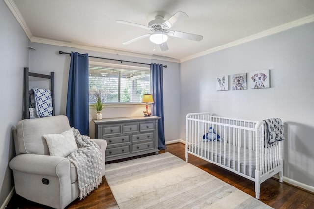 10207 Chatterton Dr, Houston, TX 77043 - bedroom featuring dark wood-type flooring, ornamental molding, baseboards, and a nursery area