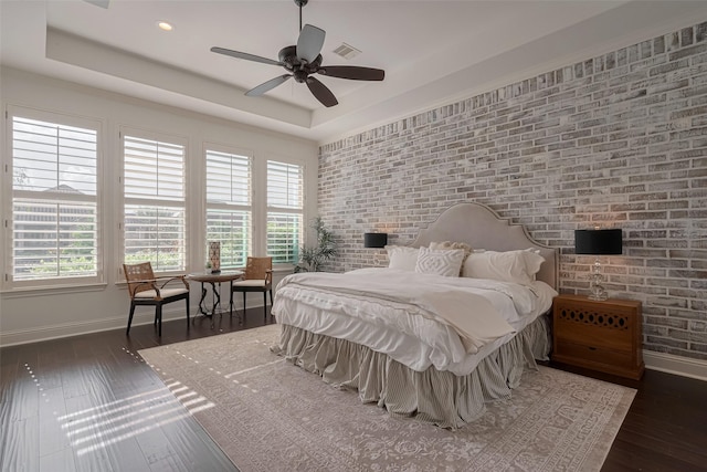 7 Edgemont Ct, Fulshear, TX 77441 - bedroom featuring hardwood / wood-style floors, baseboards, multiple windows, brick wall, and recessed lighting