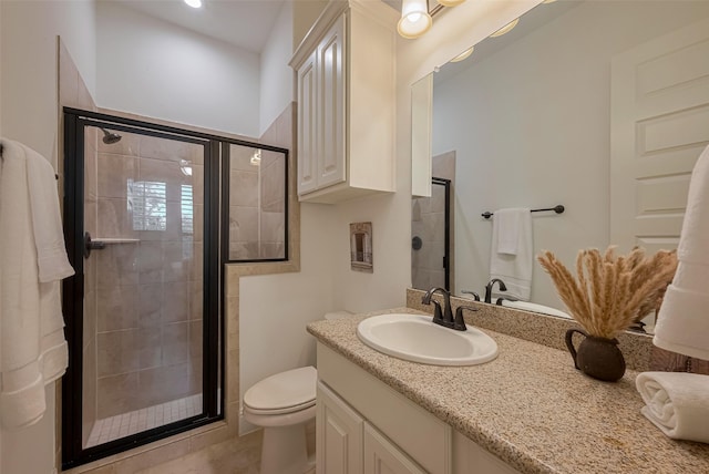 7 Edgemont Ct, Fulshear, TX 77441 - bathroom featuring a shower stall, vanity, toilet, and tile patterned flooring