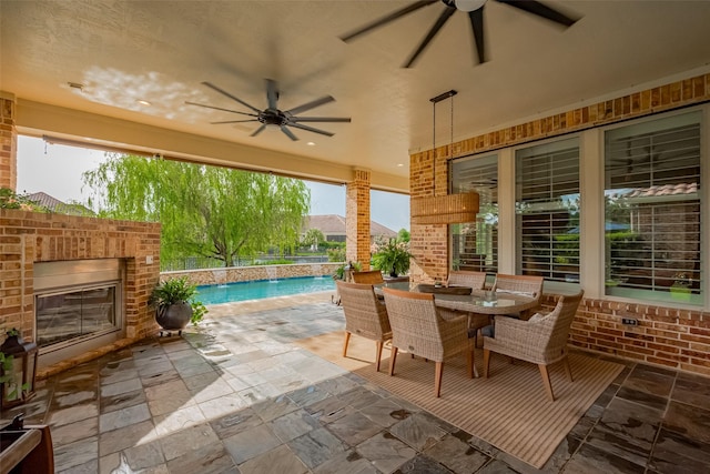 7 Edgemont Ct, Fulshear, TX 77441 - view of patio / terrace featuring a ceiling fan, an outdoor brick fireplace, outdoor dining area, and an outdoor pool