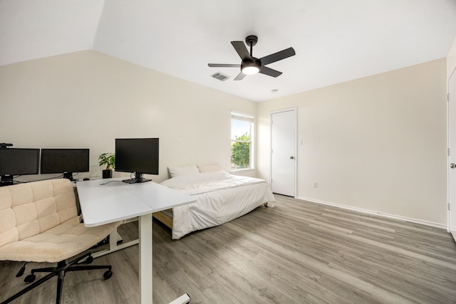 3107 Snug Harbour Ct, Katy, TX 77449 - bedroom with light wood finished floors, a desk, baseboards, a ceiling fan, and vaulted ceiling