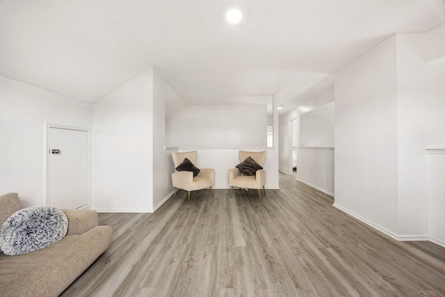 3107 Snug Harbour Ct, Katy, TX 77449 - sitting room featuring wood finished floors, baseboards, and lofted ceiling