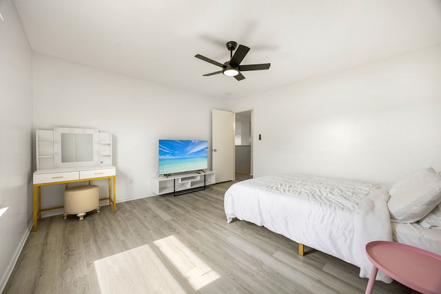 3107 Snug Harbour Ct, Katy, TX 77449 - bedroom with wood finished floors, baseboards, and ceiling fan