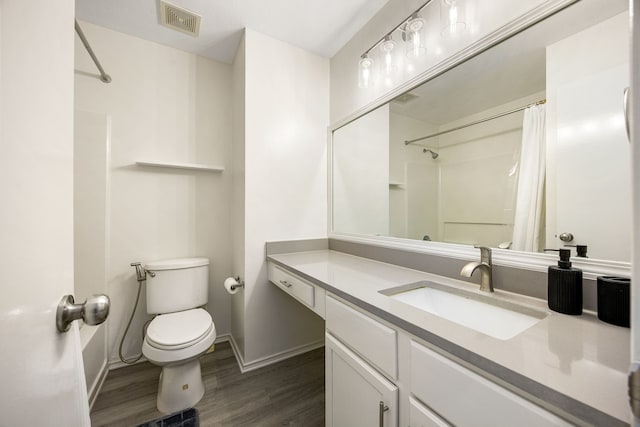 3107 Snug Harbour Ct, Katy, TX 77449 - full bath with toilet, wood finished floors, baseboards, vanity, and curtained shower