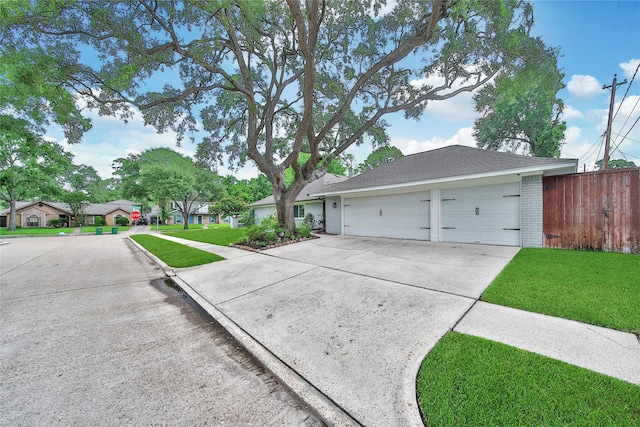 963 Thornton Rd, Houston, TX 77018 - ranch-style house featuring driveway, brick siding, a garage, and roof with shingles