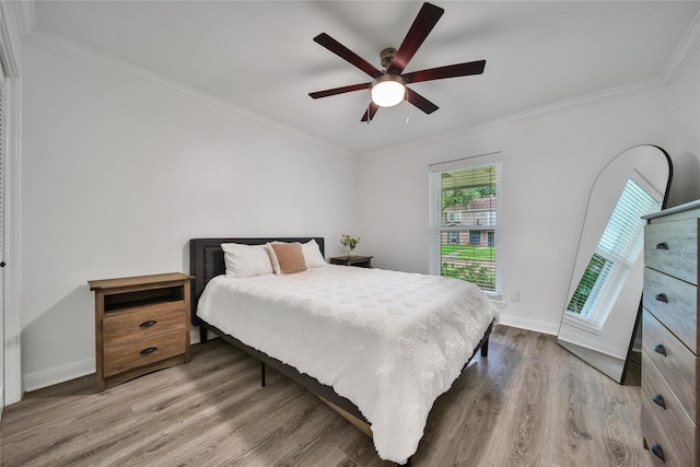 963 Thornton Rd, Houston, TX 77018 - bedroom featuring wood finished floors, ornamental molding, baseboards, and ceiling fan