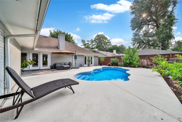 963 Thornton Rd, Houston, TX 77018 - view of pool with an outdoor hangout area, a patio, a fenced backyard, and french doors