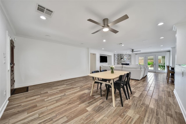 963 Thornton Rd, Houston, TX 77018 - dining area featuring a ceiling fan, french doors, wood finished floors, ornamental molding, and baseboards