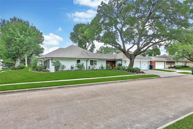 963 Thornton Rd, Houston, TX 77018 - single story home with concrete driveway, a front lawn, and a garage