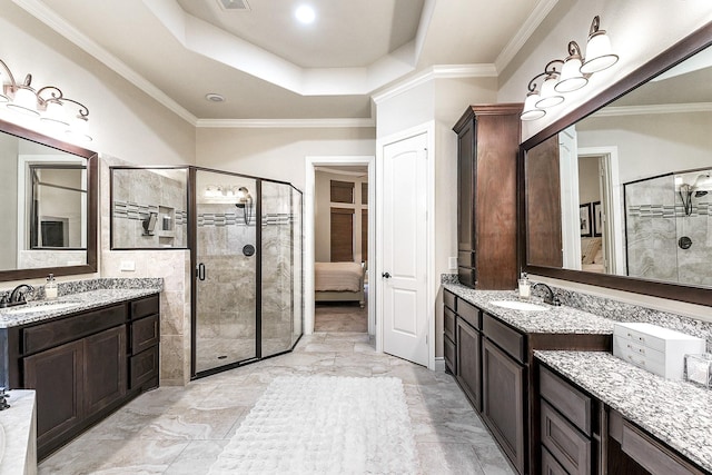 27511 Becketts Knoll Ct, Katy, TX 77494 - full bath featuring a stall shower, two vanities, a raised ceiling, and ornamental molding