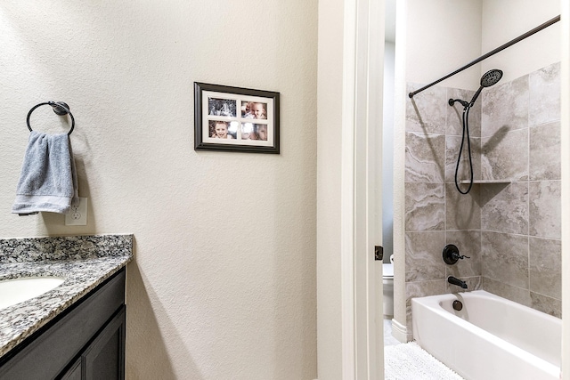 27511 Becketts Knoll Ct, Katy, TX 77494 - bathroom with vanity, toilet, shower / tub combination, and a textured wall