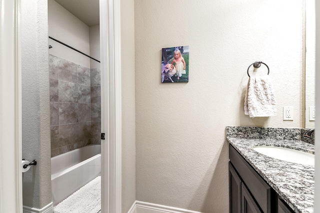 27511 Becketts Knoll Ct, Katy, TX 77494 - bathroom featuring vanity, bathtub / shower combination, and a textured wall