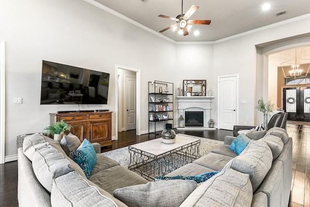 27511 Becketts Knoll Ct, Katy, TX 77494 - living area with ceiling fan, dark wood-type flooring, baseboards, a towering ceiling, and ornamental molding