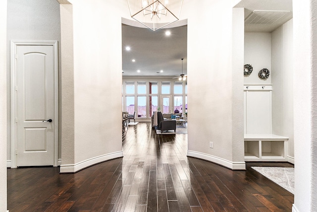 27511 Becketts Knoll Ct, Katy, TX 77494 - corridor with dark wood-style floors, baseboards, a chandelier, recessed lighting, and a textured wall