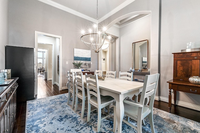 27511 Becketts Knoll Ct, Katy, TX 77494 - dining area featuring ornamental molding, baseboards, dark wood-type flooring, and a chandelier