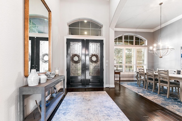 27511 Becketts Knoll Ct, Katy, TX 77494 - foyer with french doors, ornamental molding, hardwood / wood-style floors, a chandelier, and baseboards
