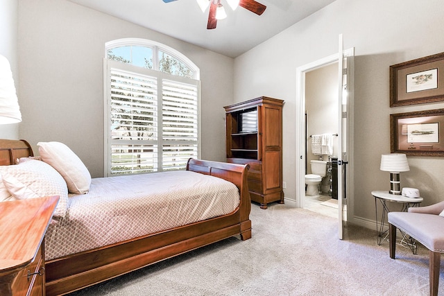 27511 Becketts Knoll Ct, Katy, TX 77494 - bedroom with light colored carpet, ensuite bath, vaulted ceiling, baseboards, and a ceiling fan
