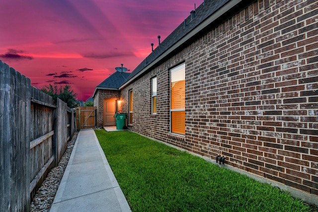 27511 Becketts Knoll Ct, Katy, TX 77494 - property exterior at dusk featuring brick siding and roof with shingles