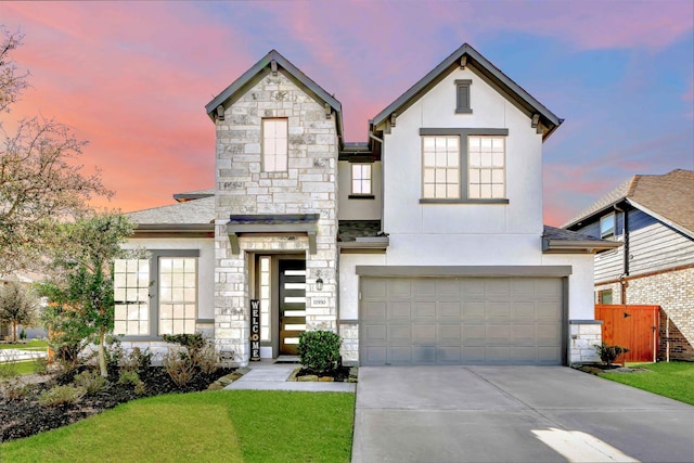 11930 Mccallister Run Dr, Humble, TX 77346 - view of front of property featuring stucco siding, stone siding, driveway, and a garage