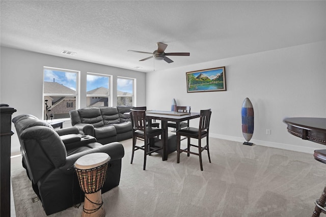 11930 Mccallister Run Dr, Humble, TX 77346 - carpeted dining room featuring ceiling fan, baseboards, and a textured ceiling