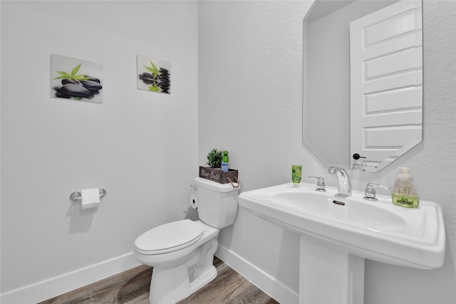 11930 Mccallister Run Dr, Humble, TX 77346 - bathroom with toilet, wood finished floors, baseboards, and a sink