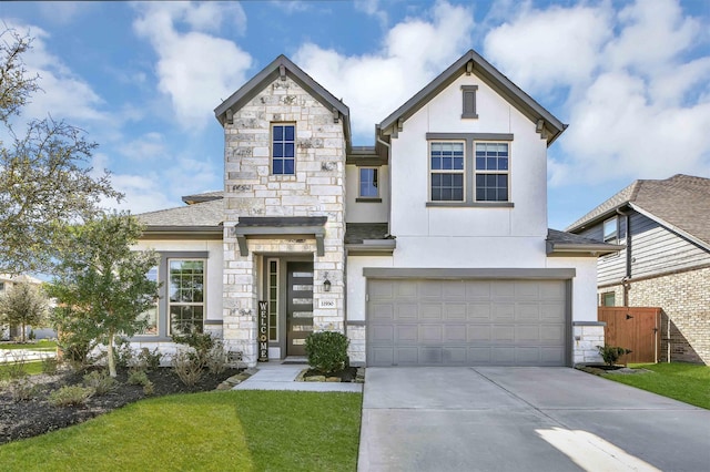 11930 Mccallister Run Dr, Humble, TX 77346 - view of front facade featuring stucco siding, driveway, a garage, and stone siding