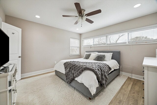 15818 Acapulco Dr, Jersey Village, TX 77040 - bedroom featuring light wood finished floors, baseboards, recessed lighting, and a ceiling fan