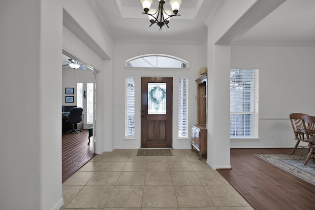 16923 Fondness Park Dr, Spring, TX 77379 - foyer entrance with a chandelier, light wood-type flooring, crown molding, and baseboards