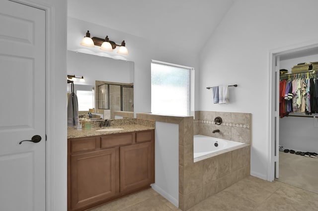 16923 Fondness Park Dr, Spring, TX 77379 - bathroom featuring tile patterned floors, vanity, a walk in closet, a shower stall, and a bath