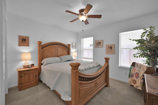 16923 Fondness Park Dr, Spring, TX 77379 - bedroom featuring light carpet, baseboards, and ceiling fan