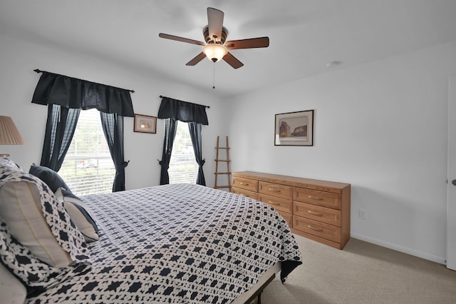 16923 Fondness Park Dr, Spring, TX 77379 - bedroom featuring baseboards, light carpet, and ceiling fan