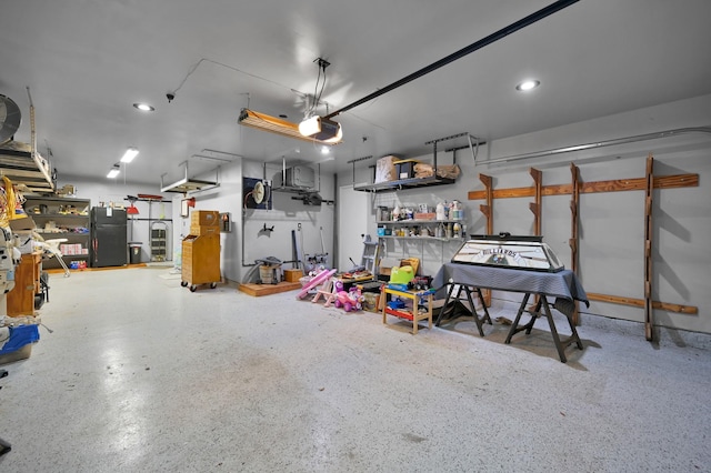16923 Fondness Park Dr, Spring, TX 77379 - garage with freestanding refrigerator, a garage door opener, and recessed lighting
