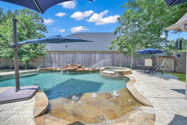 16923 Fondness Park Dr, Spring, TX 77379 - view of swimming pool featuring a fenced backyard, a pool with connected hot tub, and a patio area