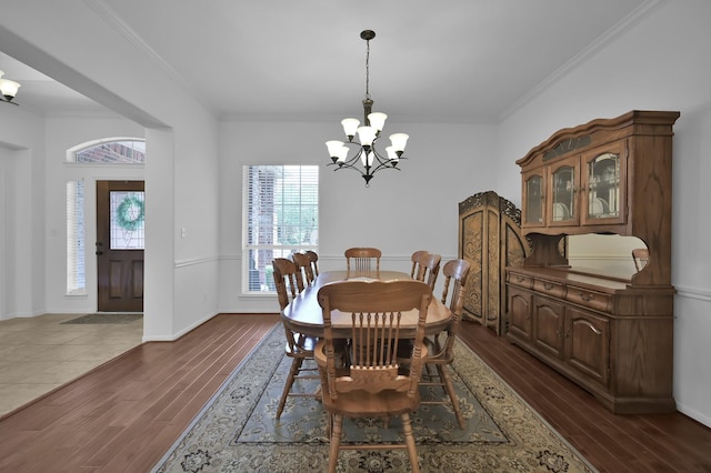 16923 Fondness Park Dr, Spring, TX 77379 - dining room featuring a chandelier, dark wood-style flooring, crown molding, and baseboards