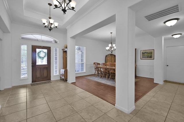 16923 Fondness Park Dr, Spring, TX 77379 - entrance foyer with a chandelier, light tile patterned floors, ornamental molding, baseboards, and a raised ceiling